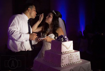 bride feeding groom the cake